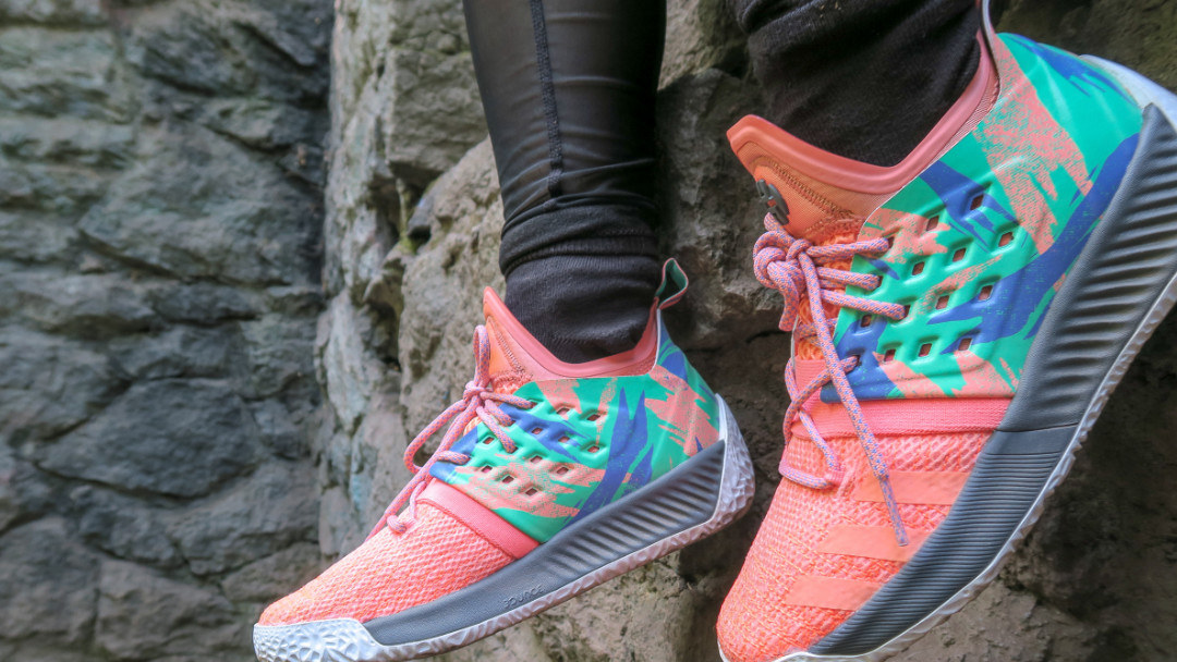 two pink, green, blue sneakers